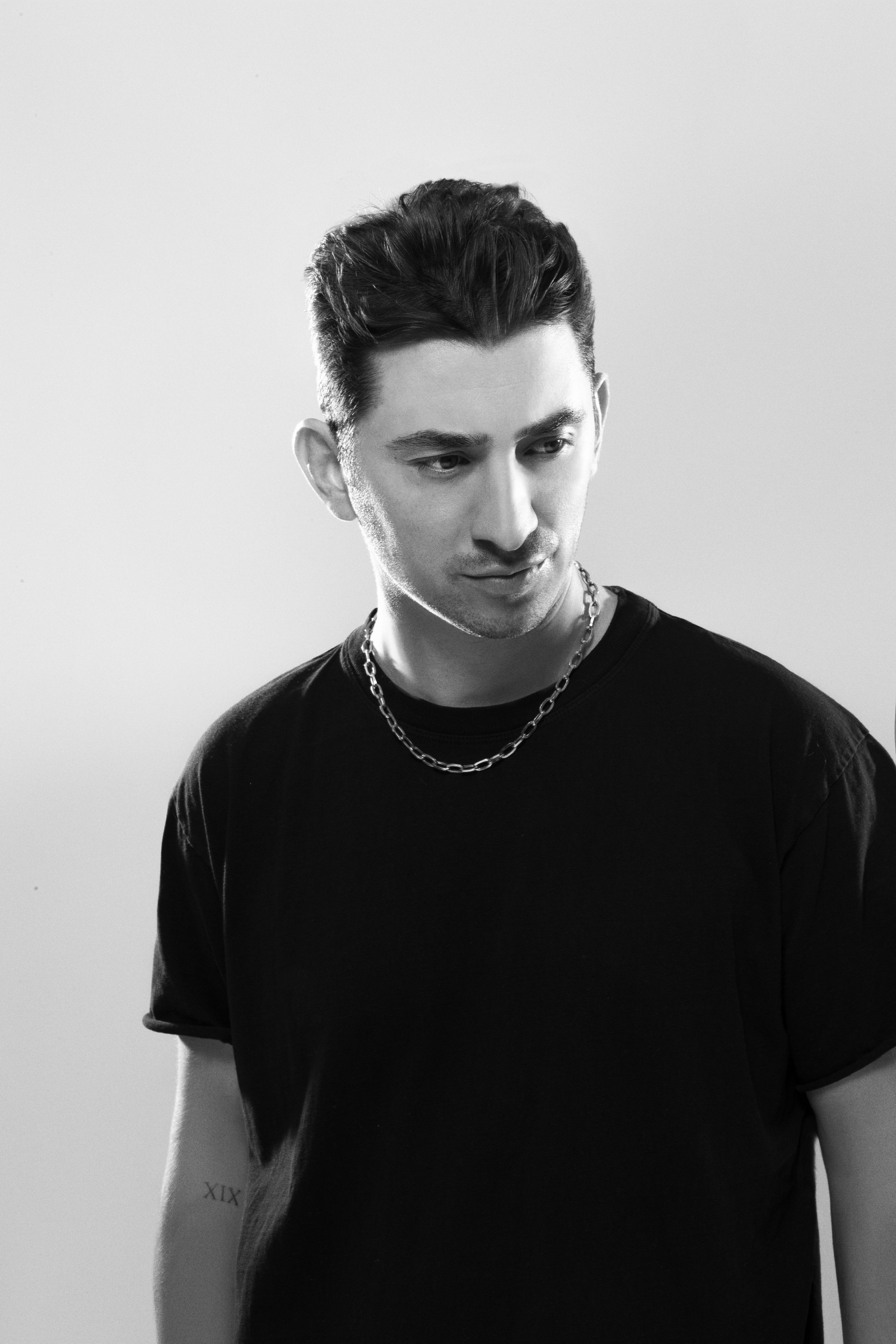 Paul Paskhover in a black shirt and chain